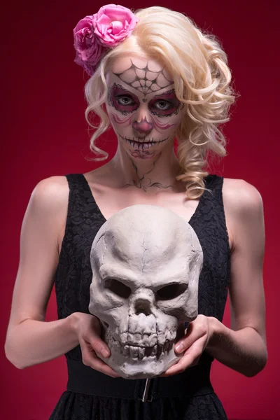 Portrait of young blond girl with Calaveras makeup and a rose fl — Stock Photo, Image