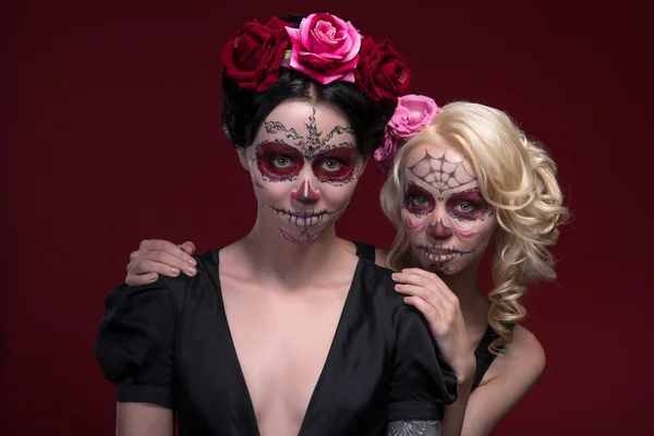 Portrait of two young girls in black dresses with Calaveras make — Stock Photo, Image