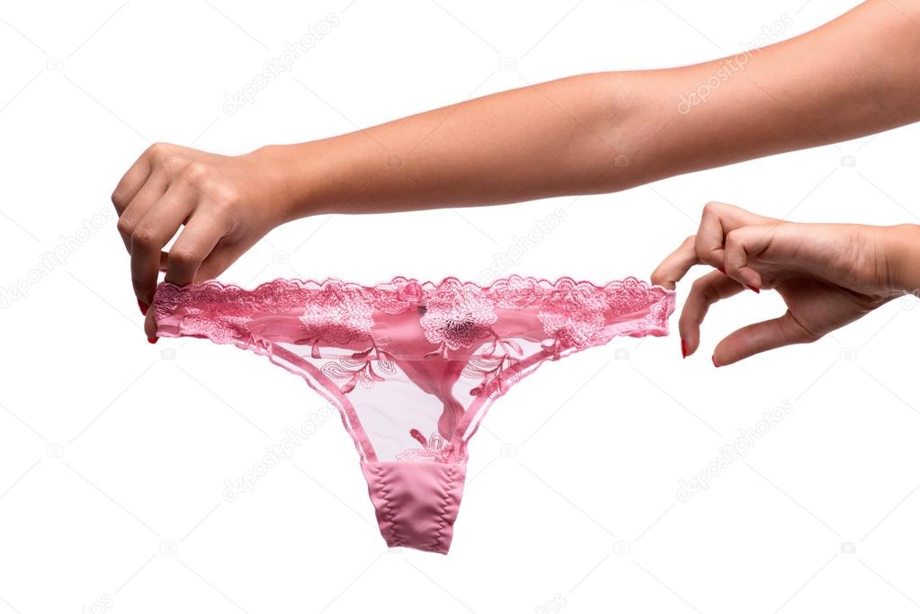 Woman hand holding pink lingerie.