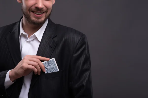 Confident man   hiding  card — Stock Photo, Image