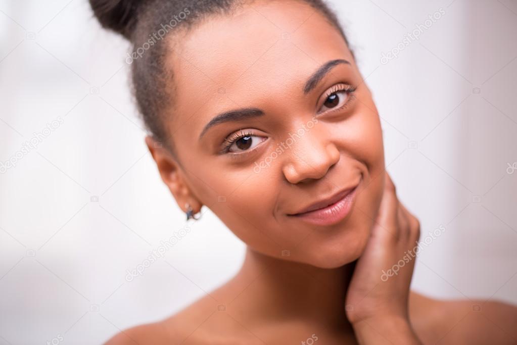 Beautiful  dark skinned girl in white towel