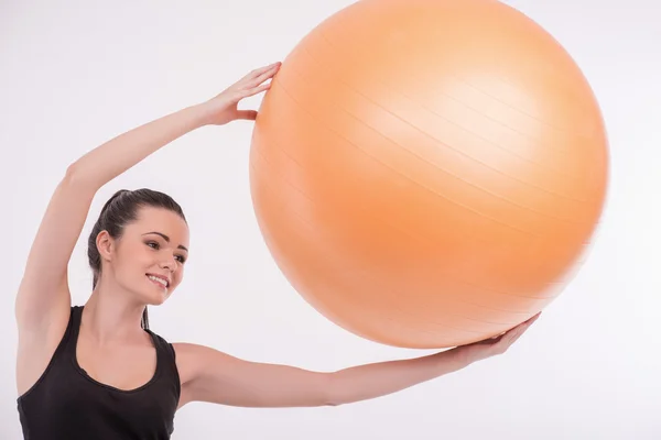 Healthy young sportswoman does the exercises — Stock Photo, Image