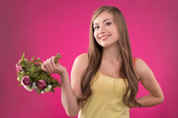 Girl holding  bunches  of roses — Stock Photo, Image