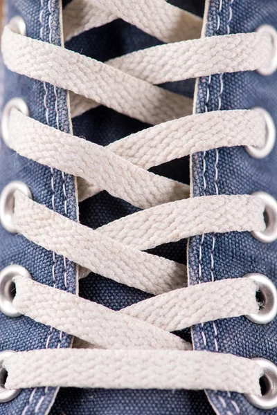 Multicolored youth gym shoes on floor — Stock Photo, Image