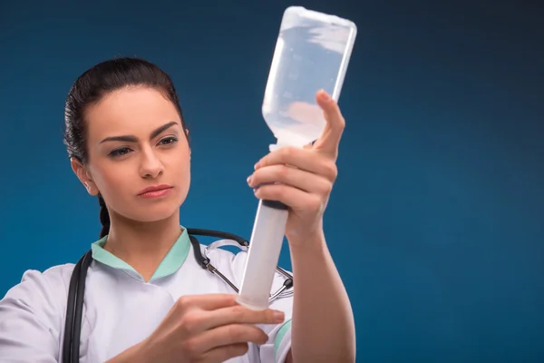 Woman doctor with dropper — Stock Photo, Image
