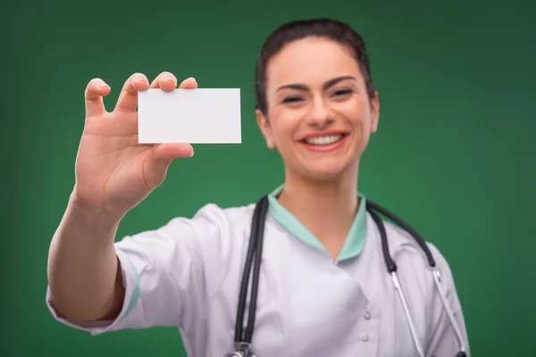 Woman doctor with blank card — Stock Photo, Image