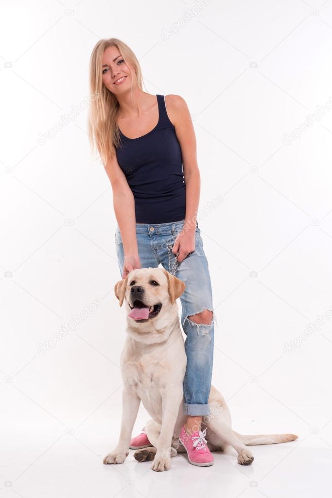 Beautiful  blond girl with Labrador Retriever