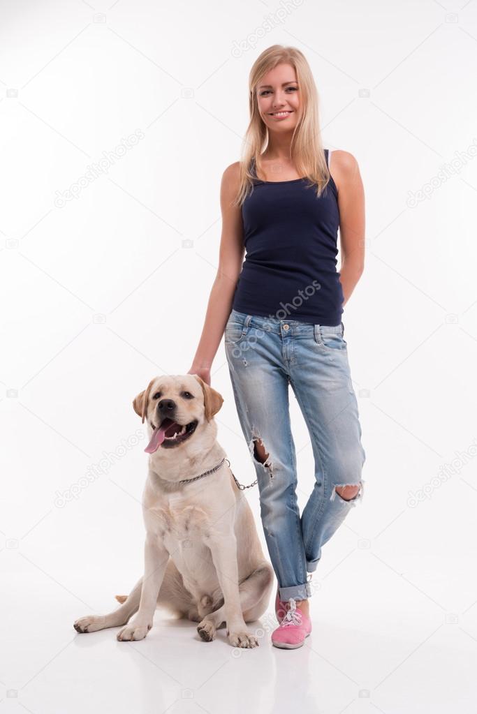 Beautiful  blond girl with Labrador Retriever