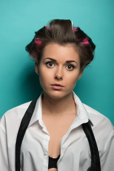 Cute brunette in hair curlers — Stock Photo, Image