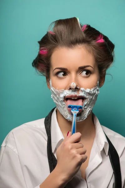 Woman shaving with razor on her tongue — Stock Photo, Image