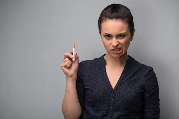 Determined girl holding cigarette — Stock Photo, Image