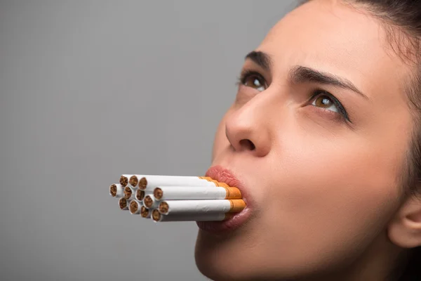 Woman with cigarettes — Stock Photo, Image