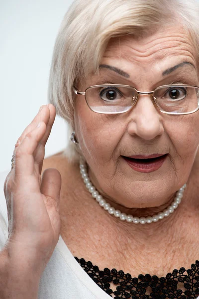 Curious granny looking at camera — Stock Photo, Image