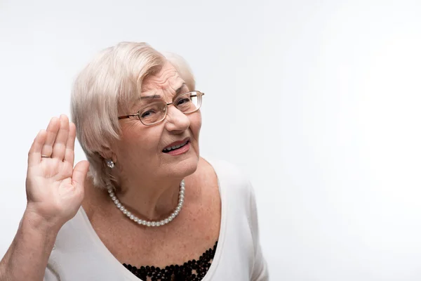 Curious granny trying to hear something — Stock Photo, Image