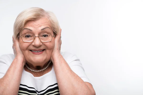 Elderly woman closes her mouth, ears and eyes with hands — Stock Photo, Image