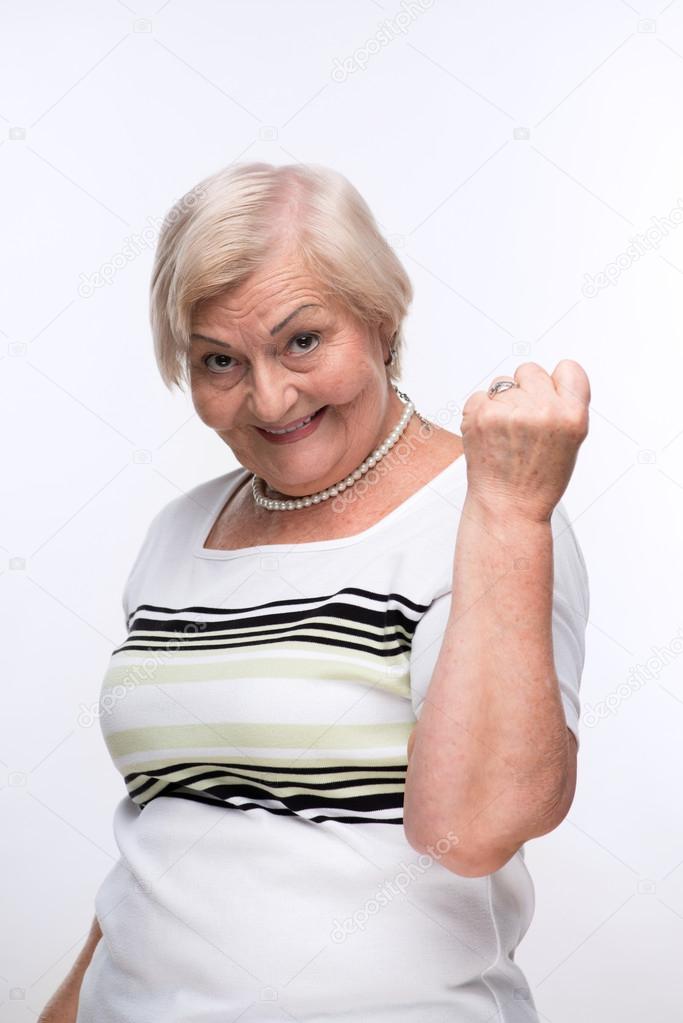 Elderly lady showing her fist