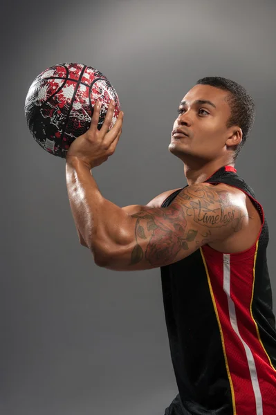 Young handsome African man playing basketball — Stock Photo, Image