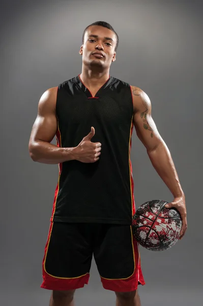 Young handsome African man playing basketball — Stock Photo, Image