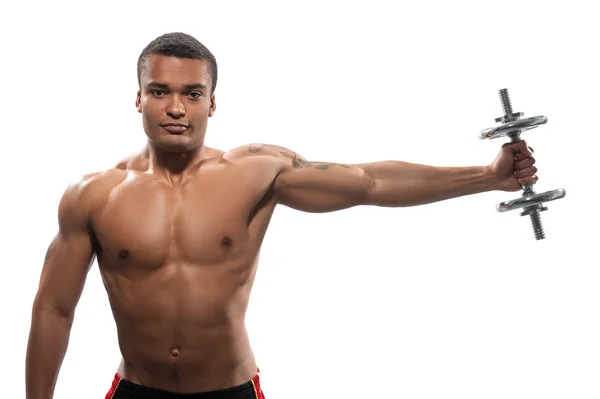 Young African sportsman exercising dumbbell — Stock Photo, Image