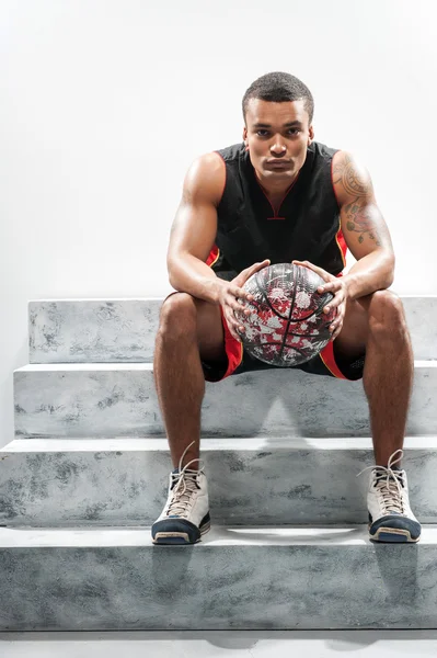 Young African sportsman playing basketball — Stock Photo, Image