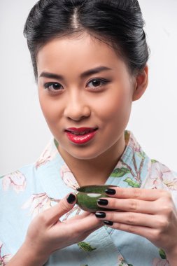 Tea ceremony conducted by Asian woman clipart
