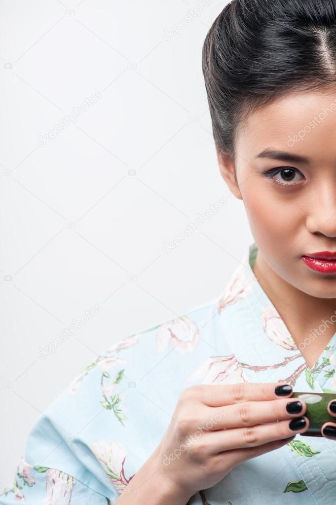 Tea ceremony conducted by Asian woman