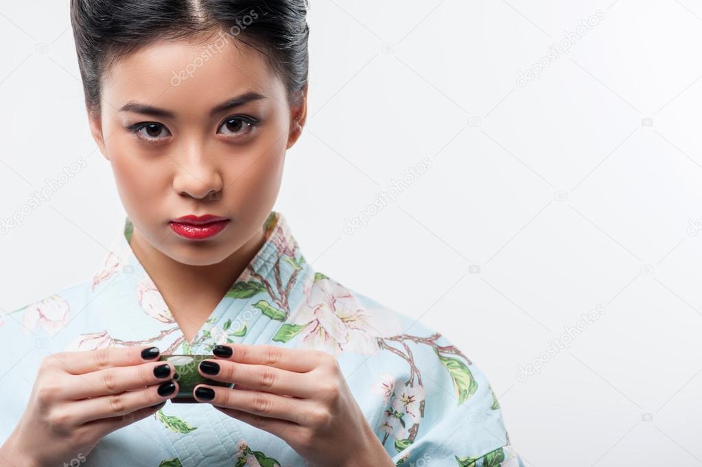 Tea ceremony conducted by Asian woman