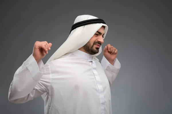 Arab man raising his hands being tired — Stock Photo, Image