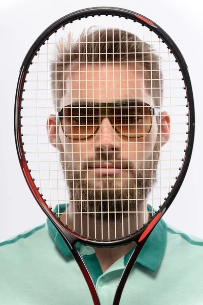 Mann hält Tennisschläger in der Hand — Stockfoto