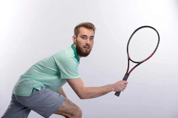 Muž držící tenisovou raketu — Stock fotografie