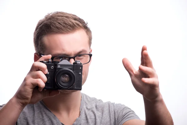 Young handsome man with photo camera — Stock Photo, Image