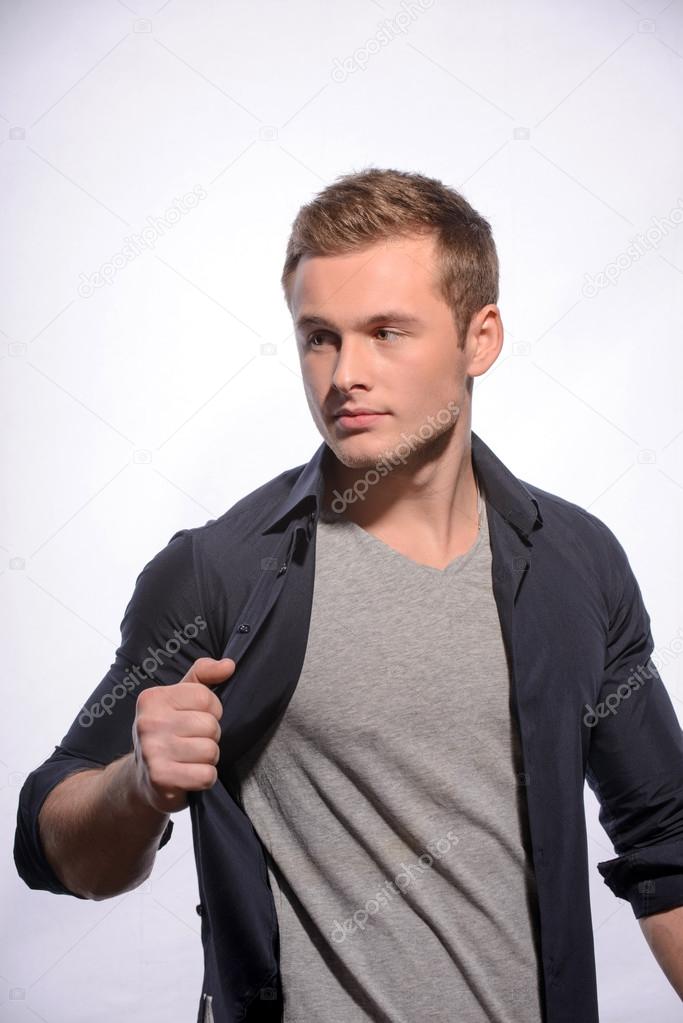 Cheerful young man posing in stylish look