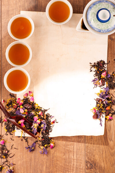 Still life of tea cups and herbs