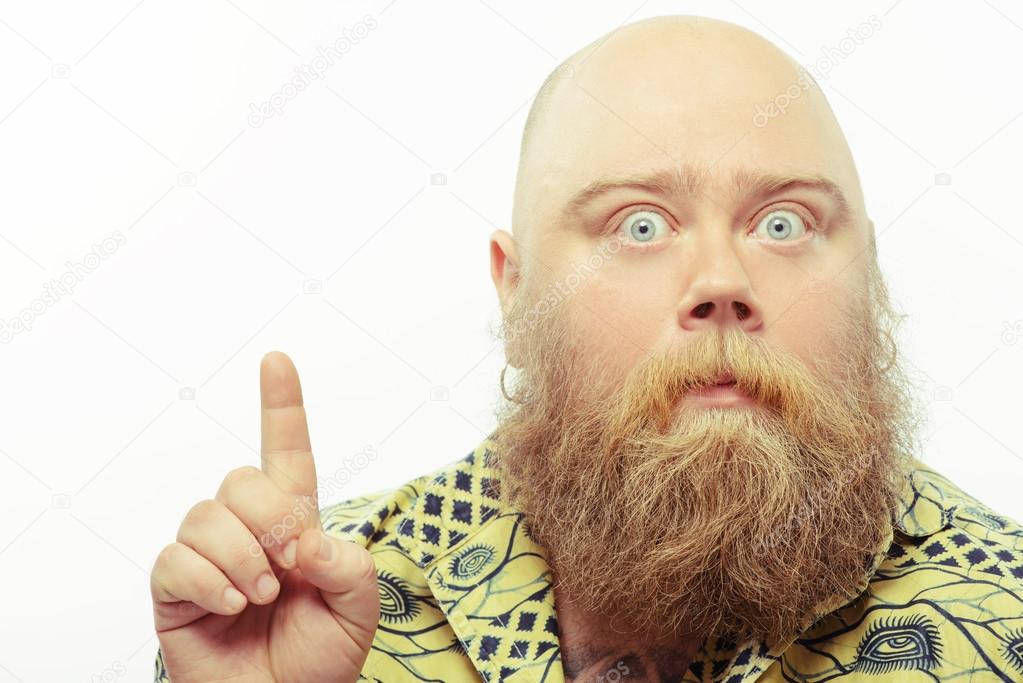 Surprised bearded man pointing up