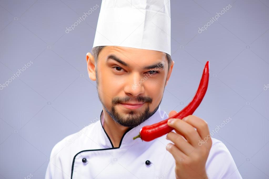 Portrait of young handsome cook