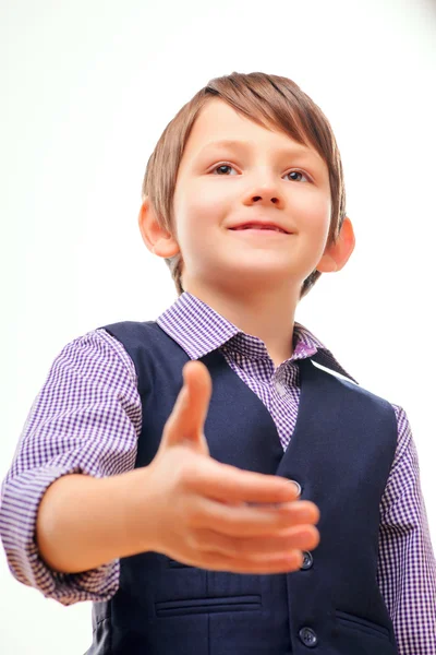 Cute child in suit stretching out hand — Stock Photo, Image