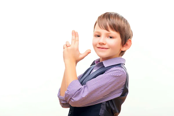 Cute schoolchild with imagined gun — Stock Photo, Image