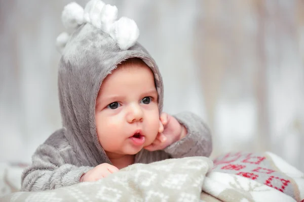 Adorable little baby in a funny bodysuit — Stock Photo, Image