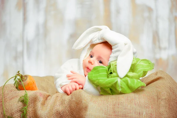 Adorable little baby in a funny bunny bodysuit — Stock Photo, Image