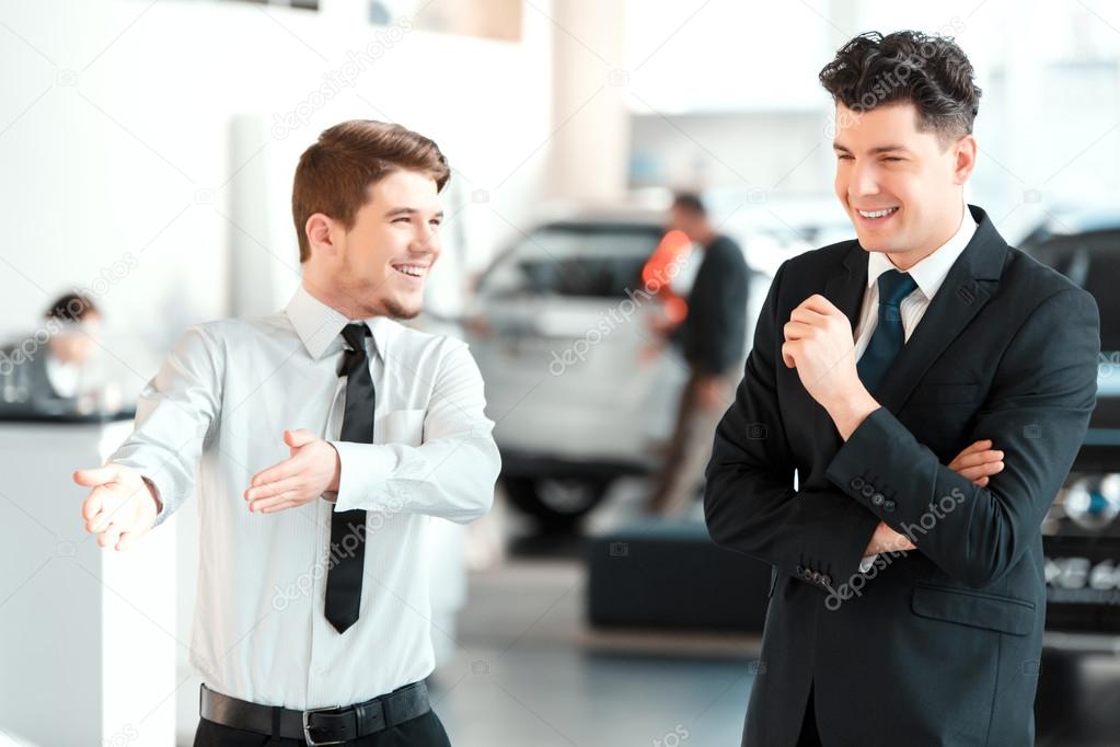 Handsome young man in dealership