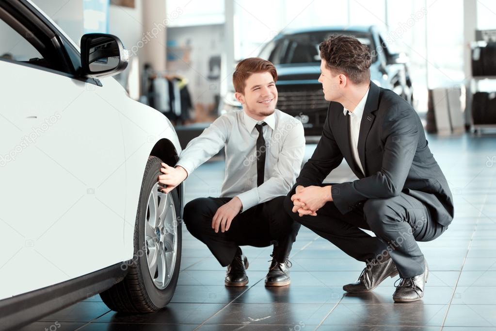 Handsome young man in dealership