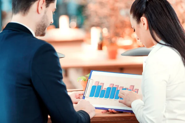 Businesspeople looking at documents — Stock Photo, Image