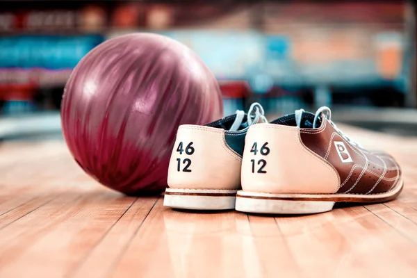 Bowling shoes and lilac ball Stock Picture