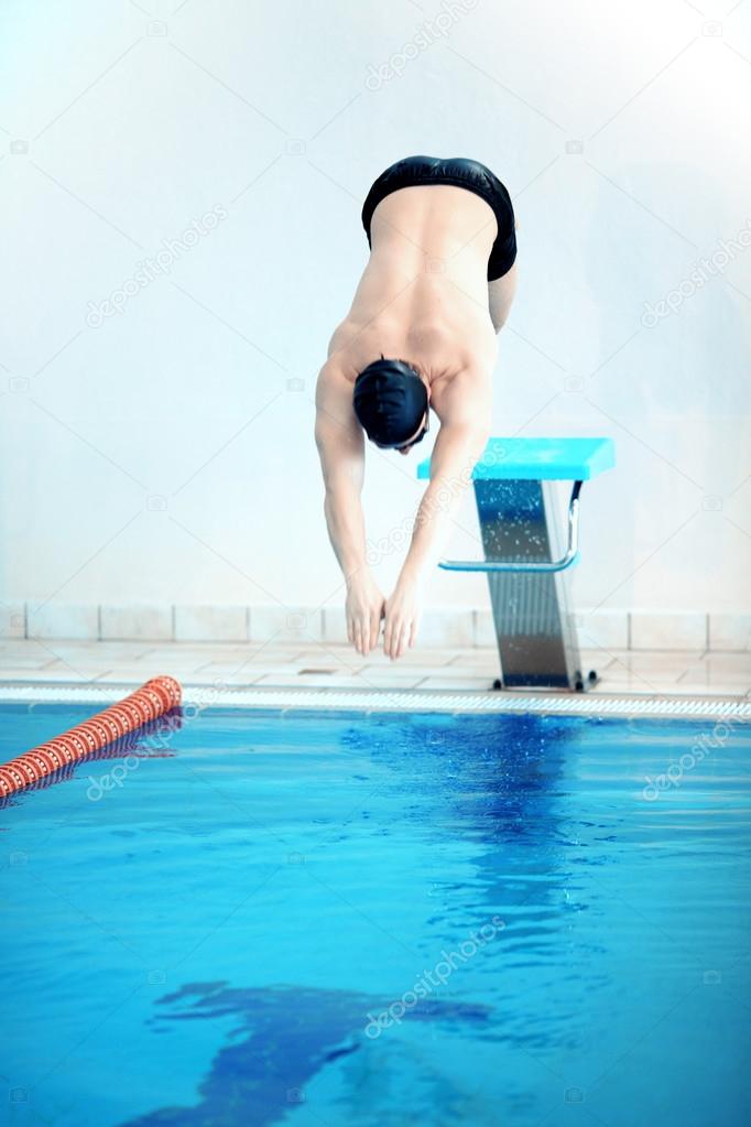 Swimmer  ready to dive in the pool