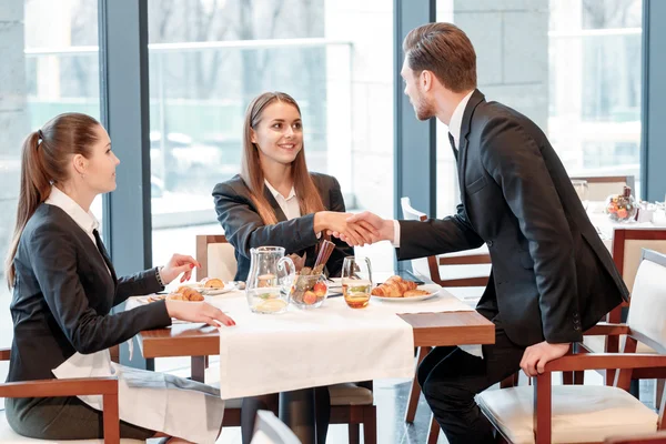 Businessman greets the partners — Stock Photo, Image