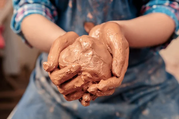 Piece of clay in hands — Stock Photo, Image