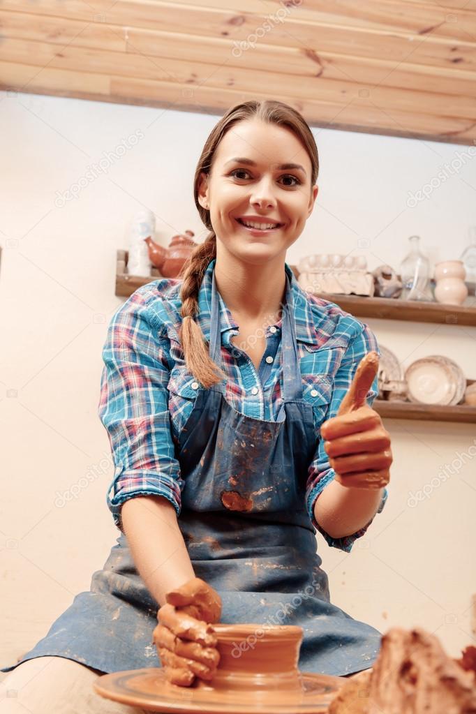 Woman shows thumbs up