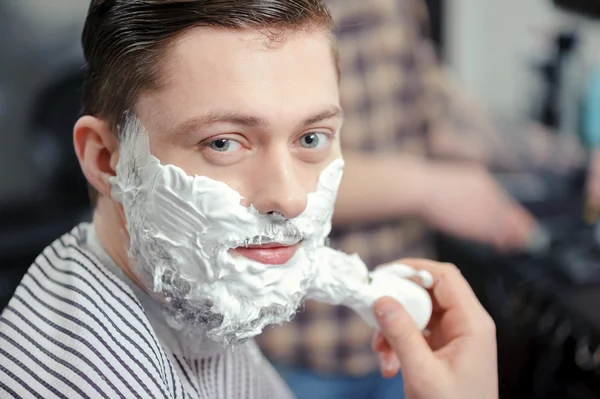 Client shaving at barber shop — Stock Photo, Image