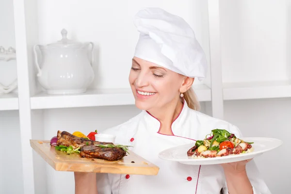 Chef-cook presenting meals — Stock Photo, Image