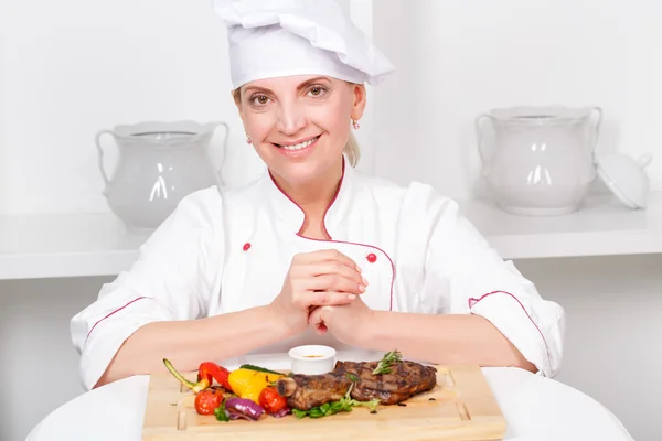 Chef-cook presenting meals — Stock Photo, Image